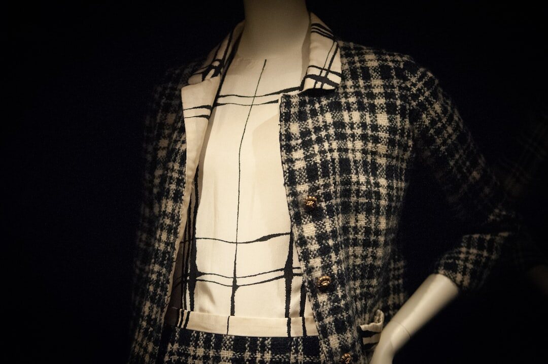 Vintage fashion editorial photograph of tailored garments on a mannequin